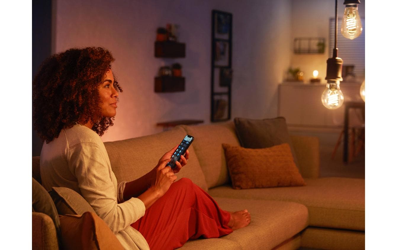 Philips by Signify Philips Hue Smart-Leuchtmittel E27 Weiss – 550 lm, 2100 K, App, dimmbar