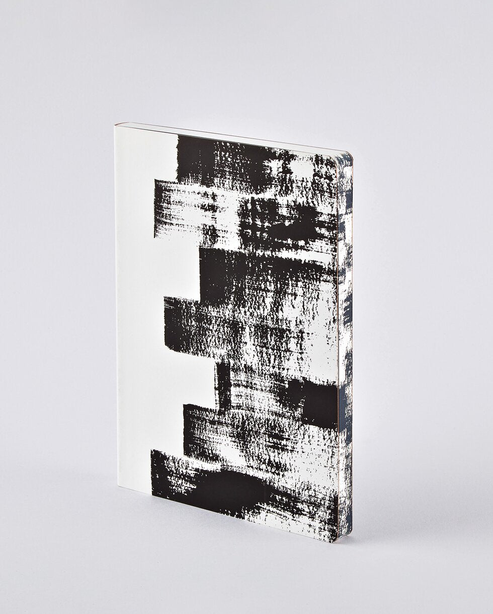 nuuna Notizbuch – A5 – 120 g/m² – Fadenheftung, nummerierte Seiten, Einband aus recyceltem Leder – schwarz/weiß
