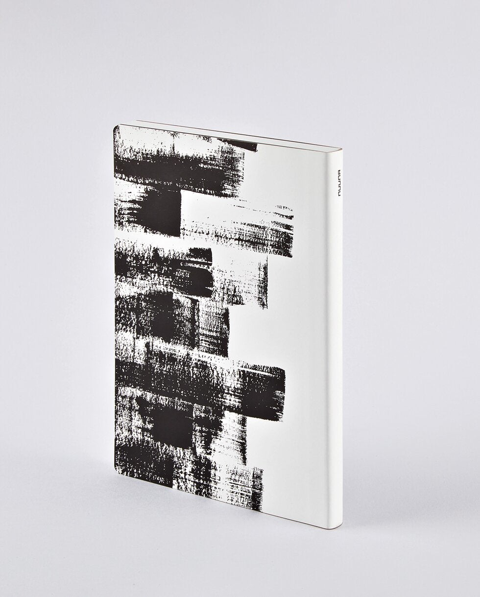 nuuna Notizbuch – A5 – 120 g/m² – Fadenheftung, nummerierte Seiten, Einband aus recyceltem Leder – schwarz/weiß